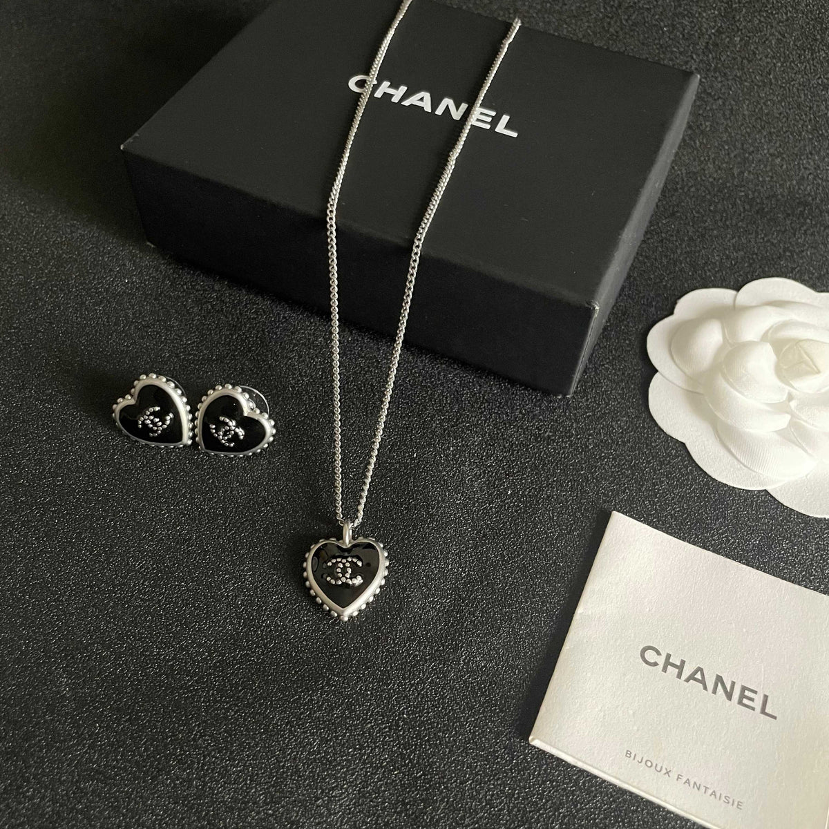 Double-C Emblem Stud Earrings in Polished Metal-Tone – Heart Detail – Design 012 close-up detail