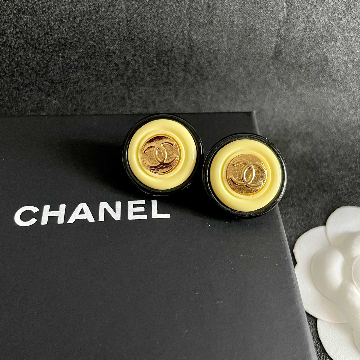 Double-C Emblem Stud Earrings in Polished Metal-Tone – Design 332 detail view