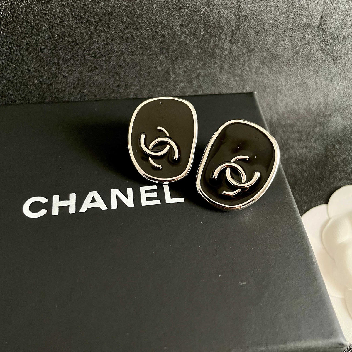 Double-C Emblem Stud Earrings in Polished Metal-Tone – Design 331 detail view