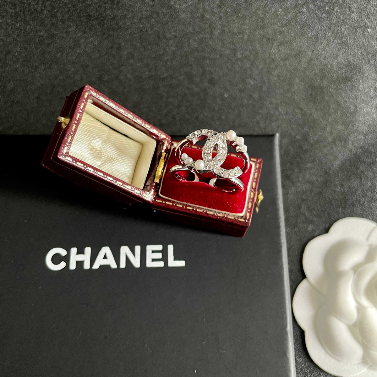 Double-C Emblem Statement Ring in Polished Metal-Tone – White Detail – Design 002 detail view