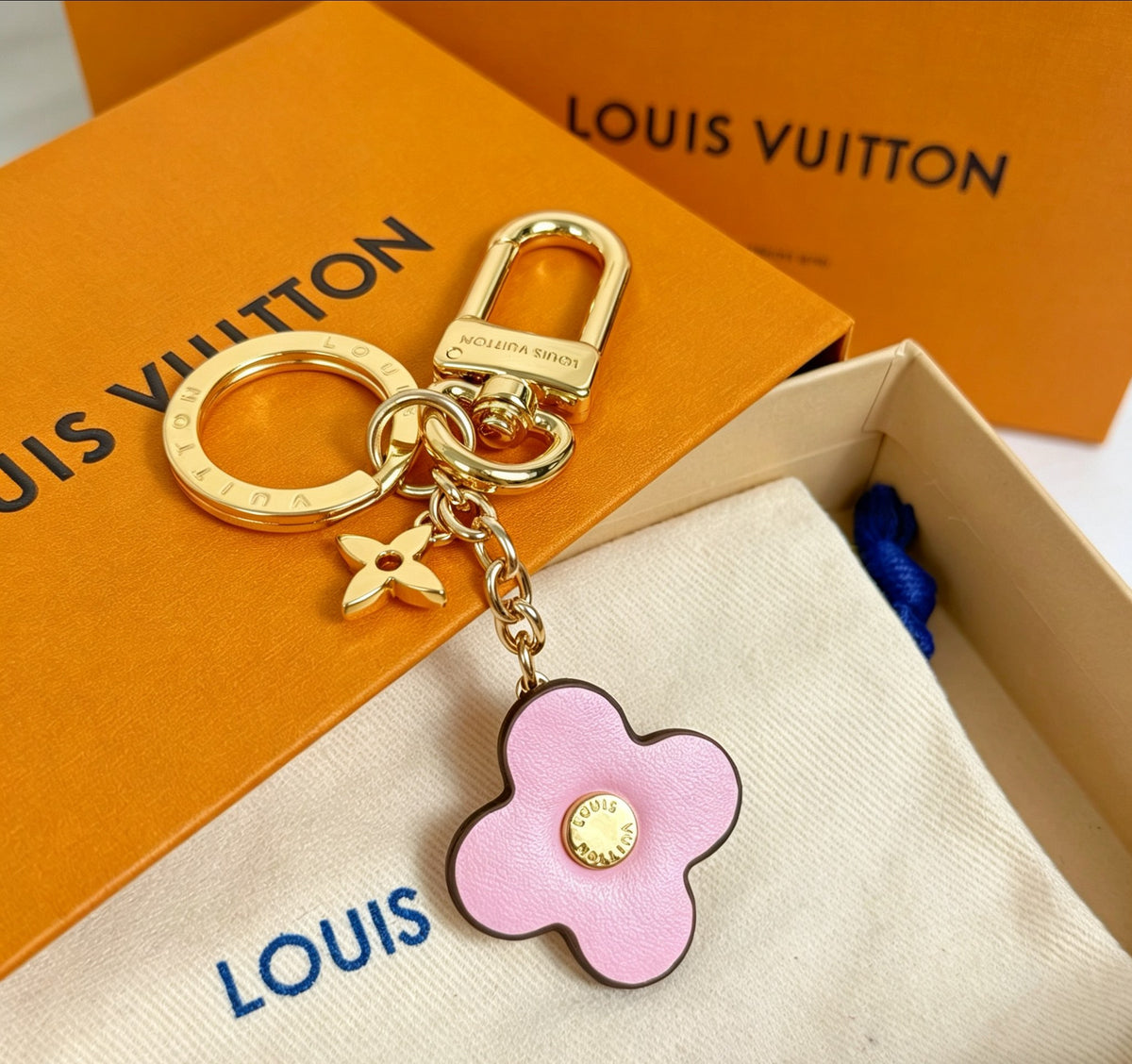Signature Emblem Jewelry Accessory in Gold-Tone – Pink Detail close-up detail