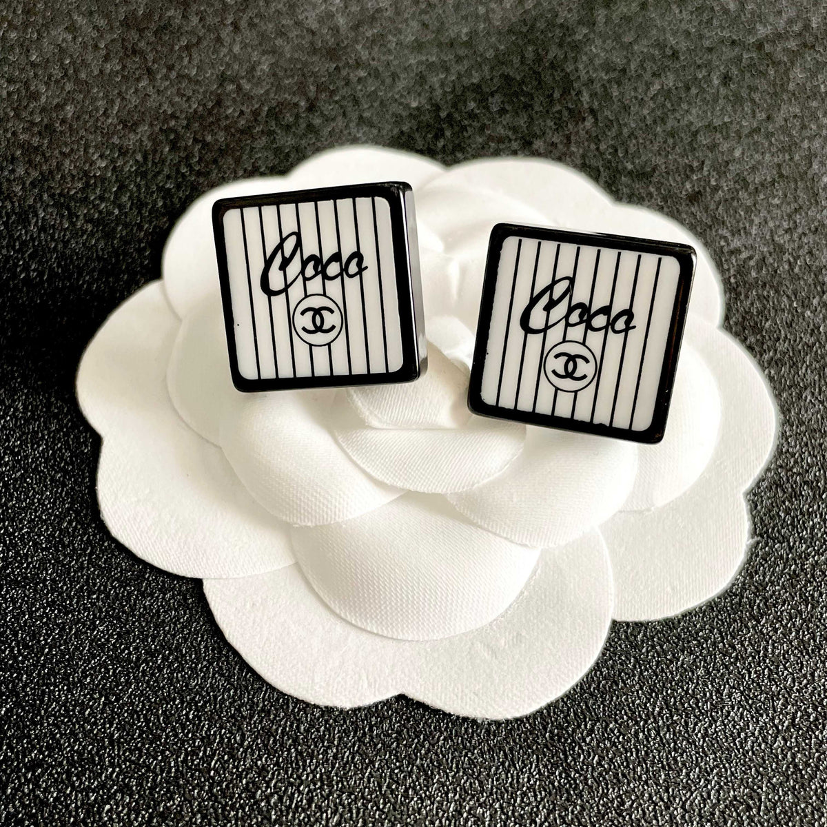 Double-C Emblem Stud Earrings in Polished Metal-Tone – Design 367 front product view