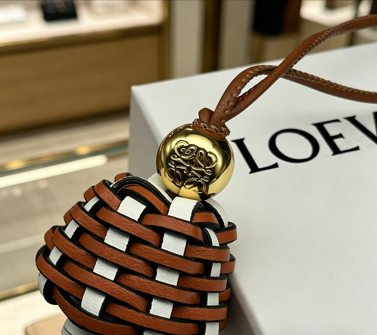 Graphic Emblem Bag Charm in Polished Metal-Tone with Leather Detail – Design 01 styled view