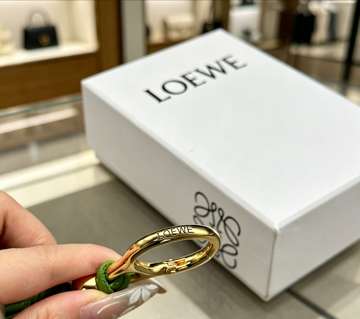 Floral Motif Bag Charm in Polished Metal-Tone with Leather Detail – Design 01 close-up detail