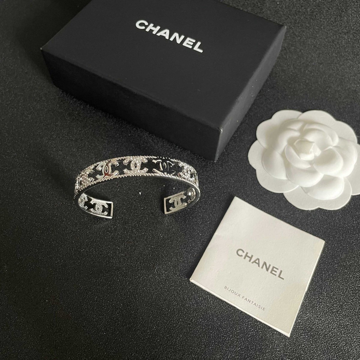Letter Bangle in Polished Metal-Tone – Red Detail close-up detail