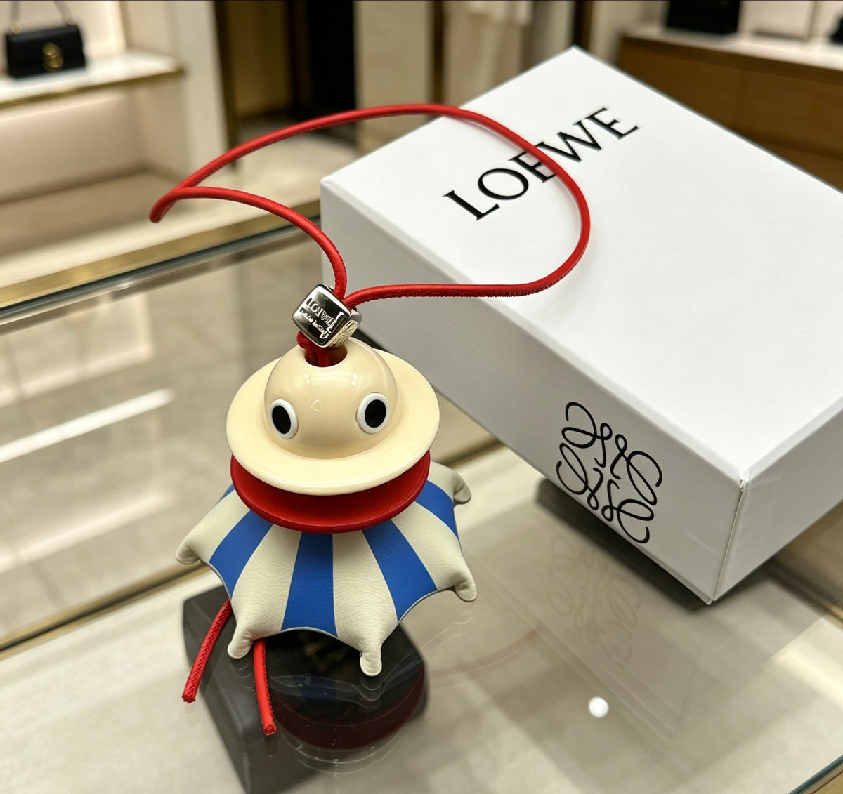 Graphic Emblem Bag Charm in Polished Metal-Tone with Leather Detail – Design 04 main product view