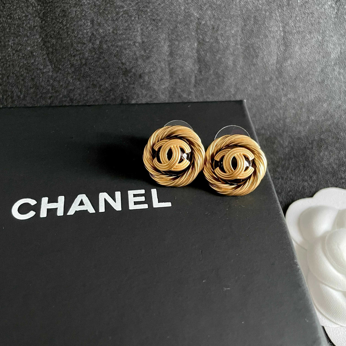 Double-C Emblem Stud Earrings in Polished Metal-Tone – Design 303 detail view