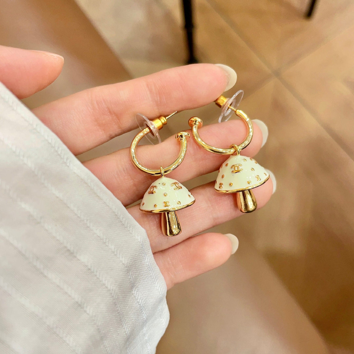 Signature Emblem Stud Earrings in Polished Metal-Tone – Design 117 side detail