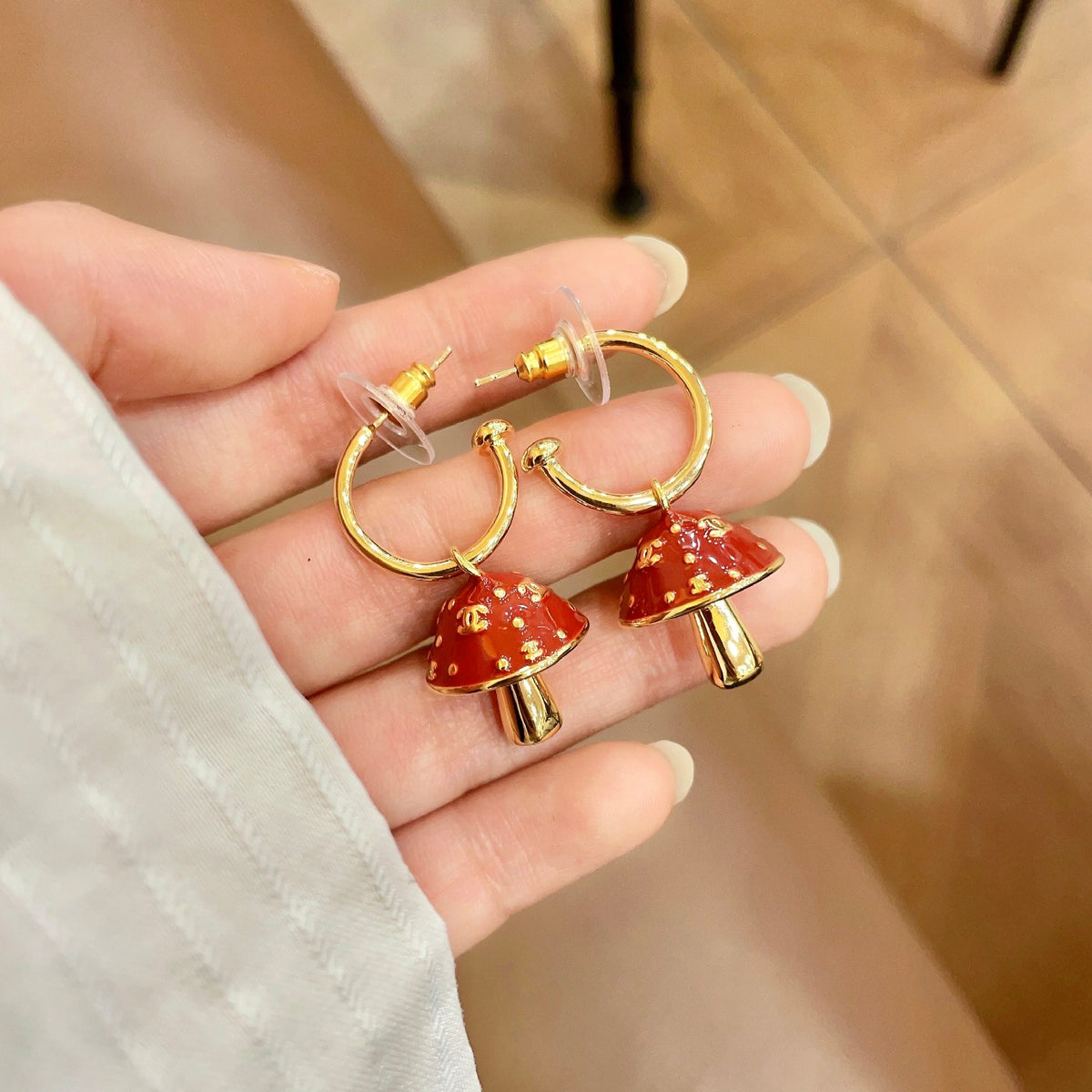 Signature Emblem Stud Earrings in Polished Metal-Tone – Design 116 side detail