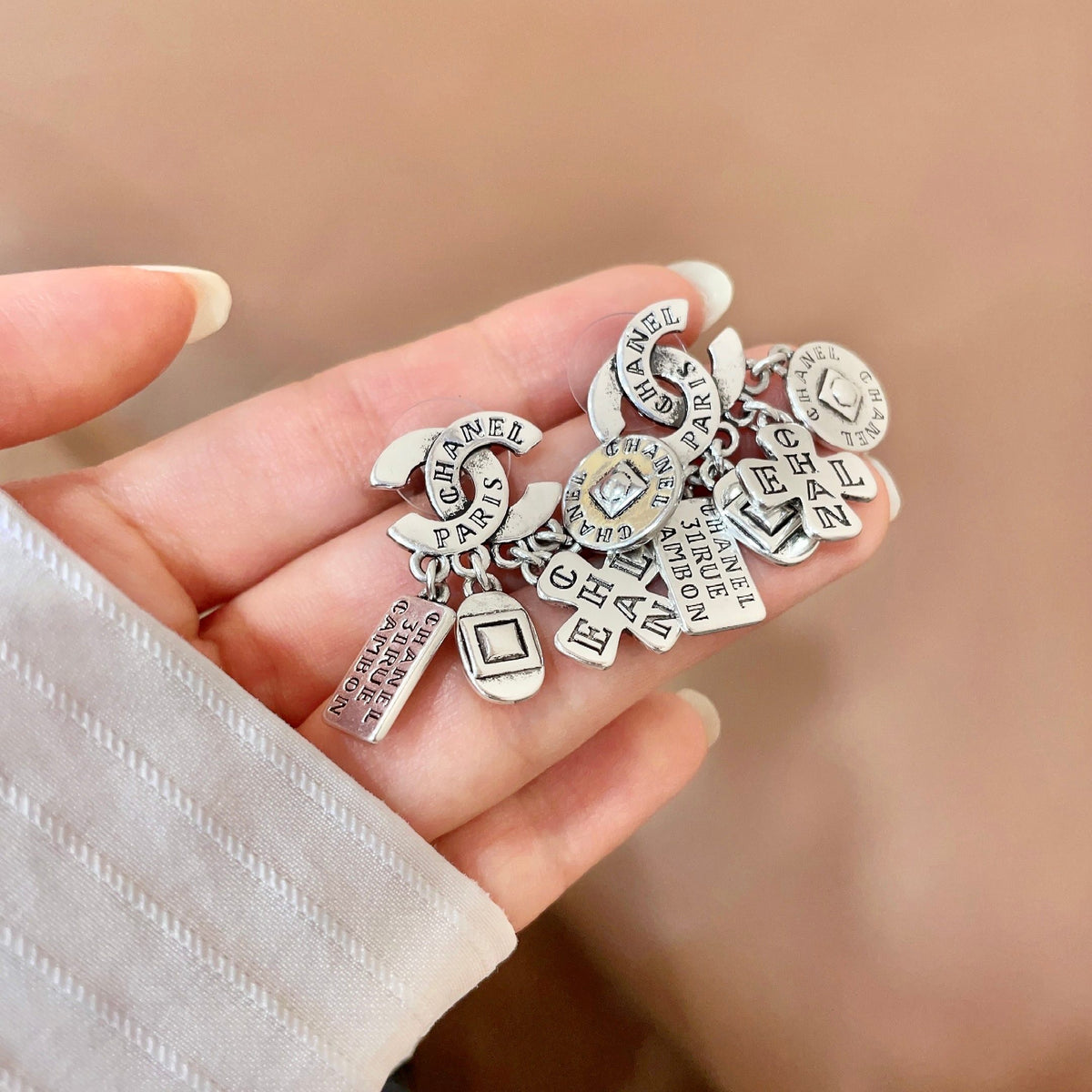 Double-C Emblem Stud Earrings in Polished Metal-Tone – Design 449 side detail
