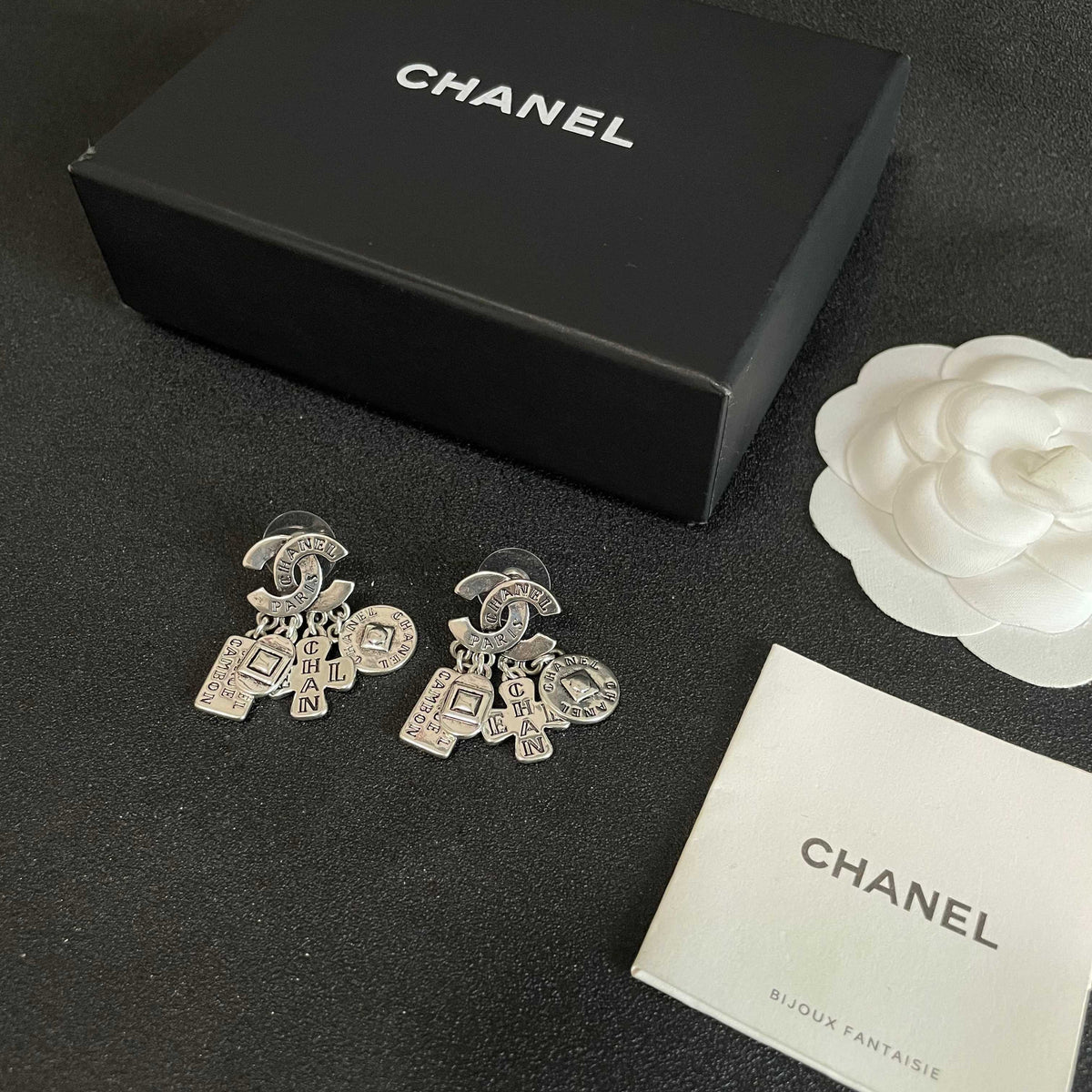 Double-C Emblem Stud Earrings in Polished Metal-Tone – Design 449 close-up detail