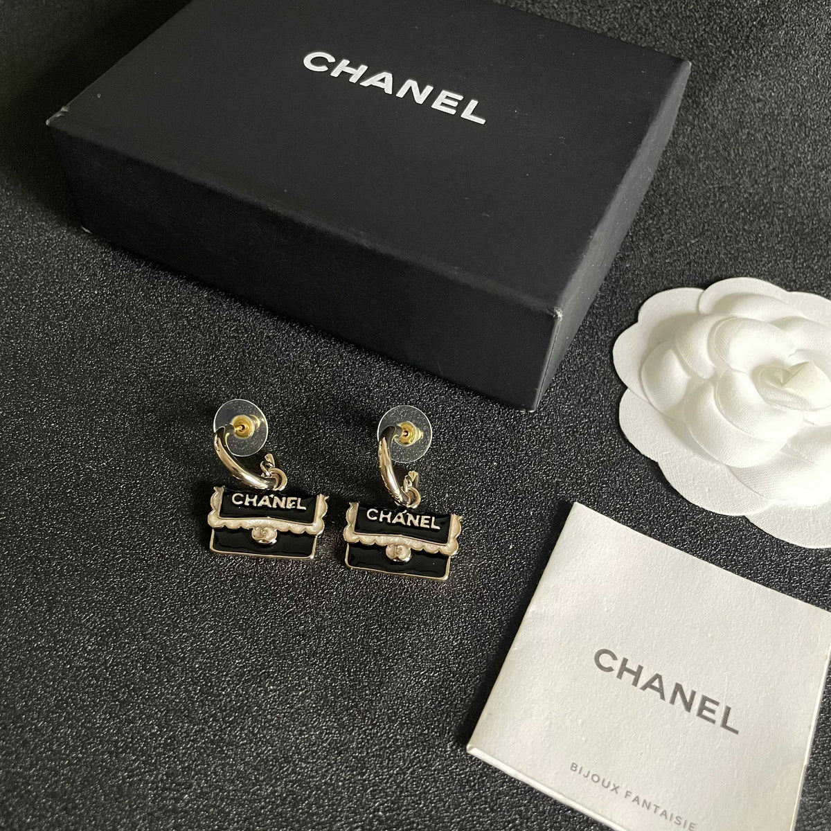 Double-C Emblem Stud Earrings in Polished Metal-Tone – Design 444 close-up detail