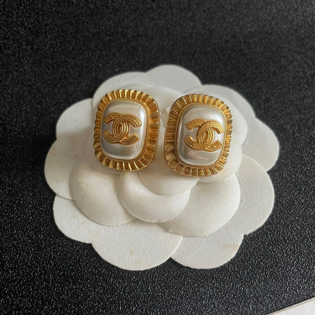 Double-C Emblem Stud Earrings in Polished Metal-Tone – Design 472 front product view