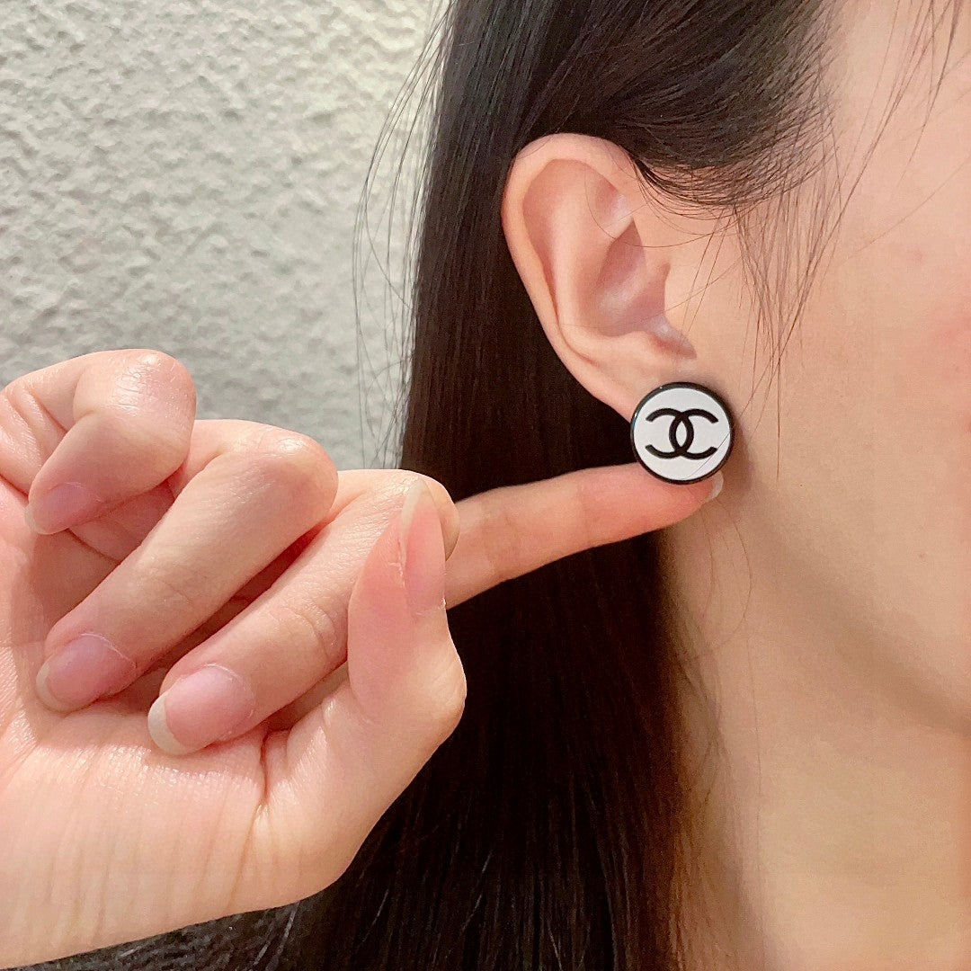 Double-C Emblem Stud Earrings in Polished Metal-Tone – Design 470 front product view