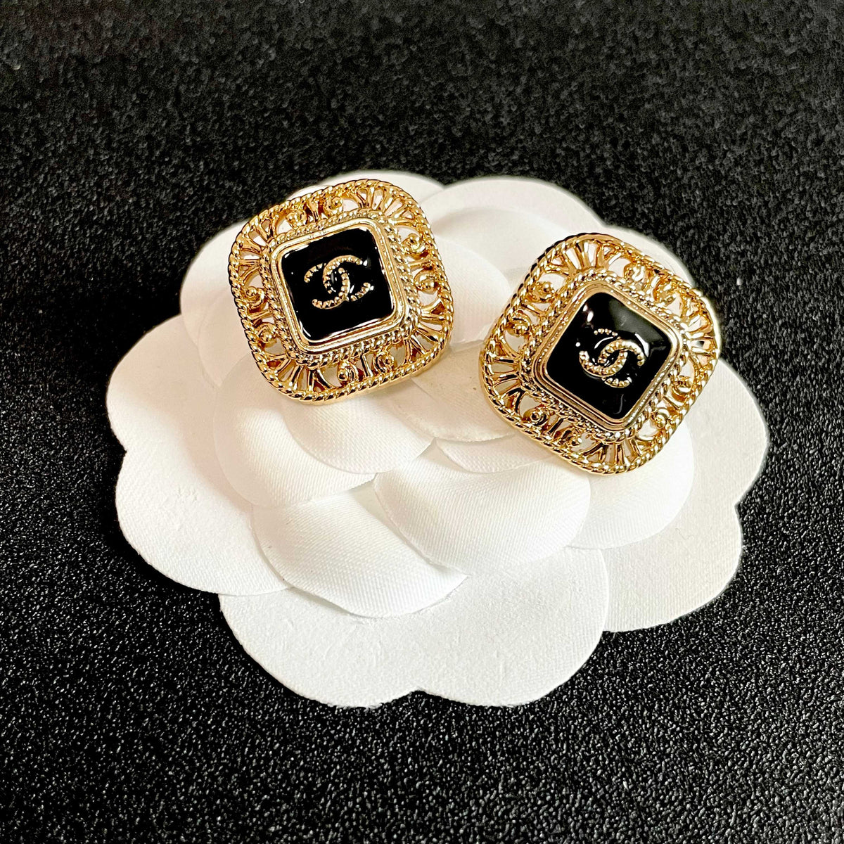 Double-C Emblem Stud Earrings in Polished Metal-Tone – Design 140 front product view