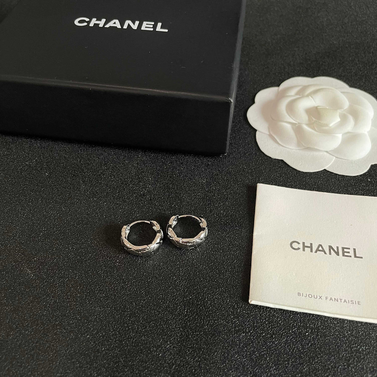 Double-C Emblem Stud Earrings in Polished Metal-Tone – Design 130 close-up detail