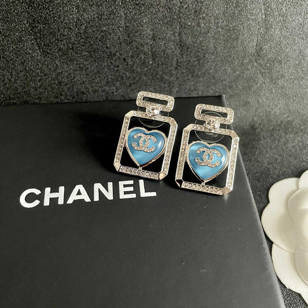 Double-C Emblem Stud Earrings in Polished Metal-Tone – Heart Detail – Design 002 detail view