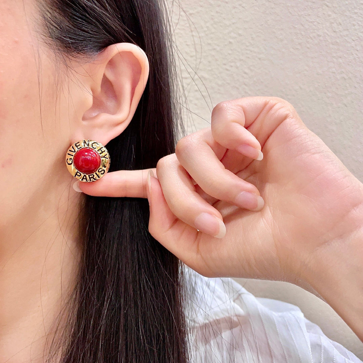 Round Emblem Stud Earrings front view