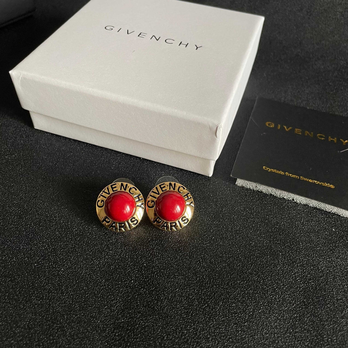 Round Emblem Stud Earrings close-up view
