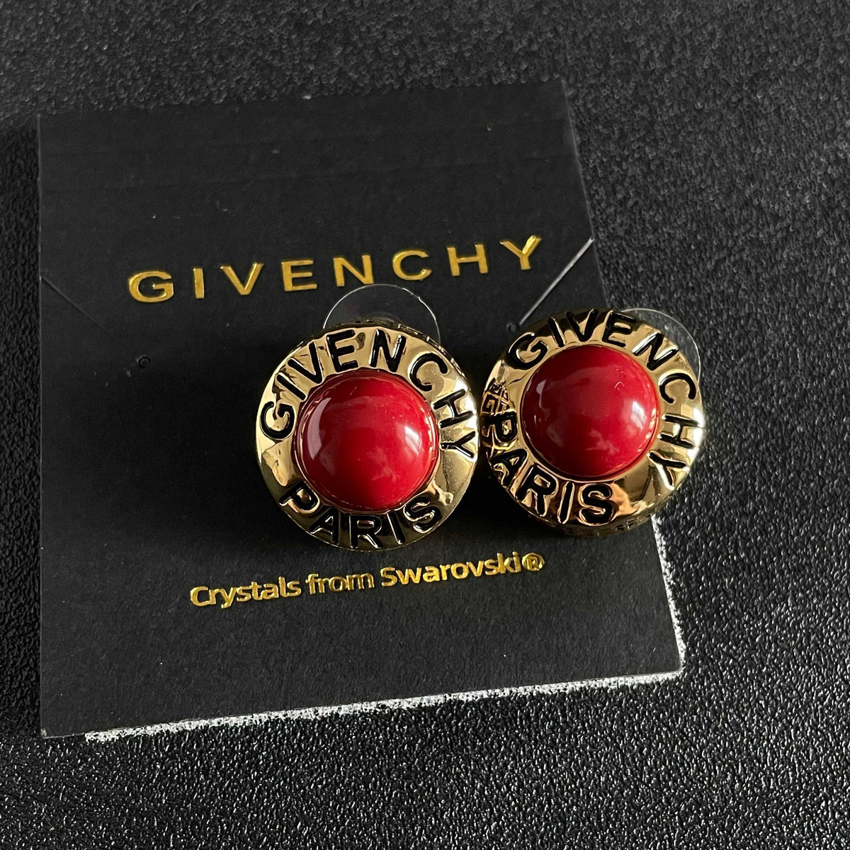 Round Emblem Stud Earrings front view