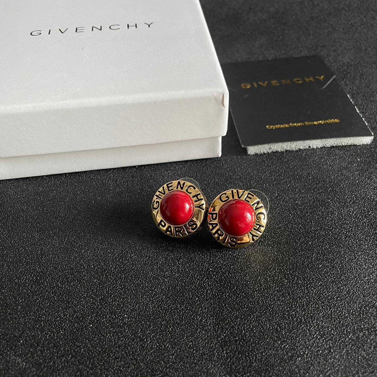 Round Emblem Stud Earrings styled detail