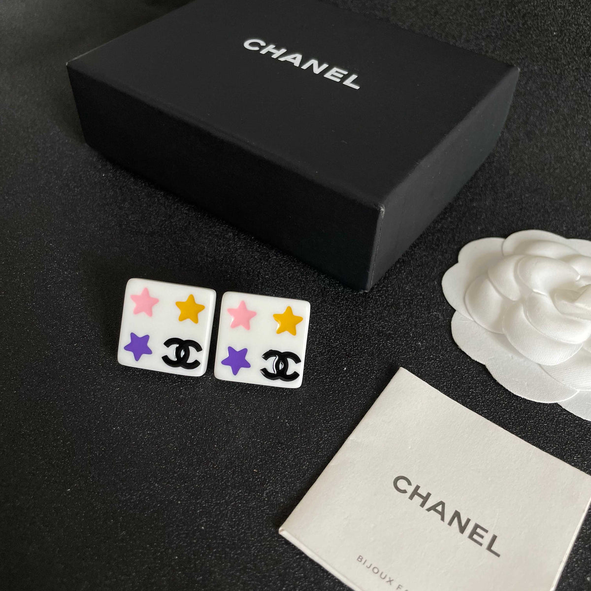 Double-C Emblem Stud Earrings in Polished Metal-Tone – Star Detail close-up detail
