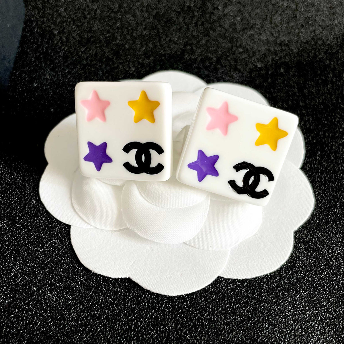 Double-C Emblem Stud Earrings in Polished Metal-Tone – Star Detail front product view