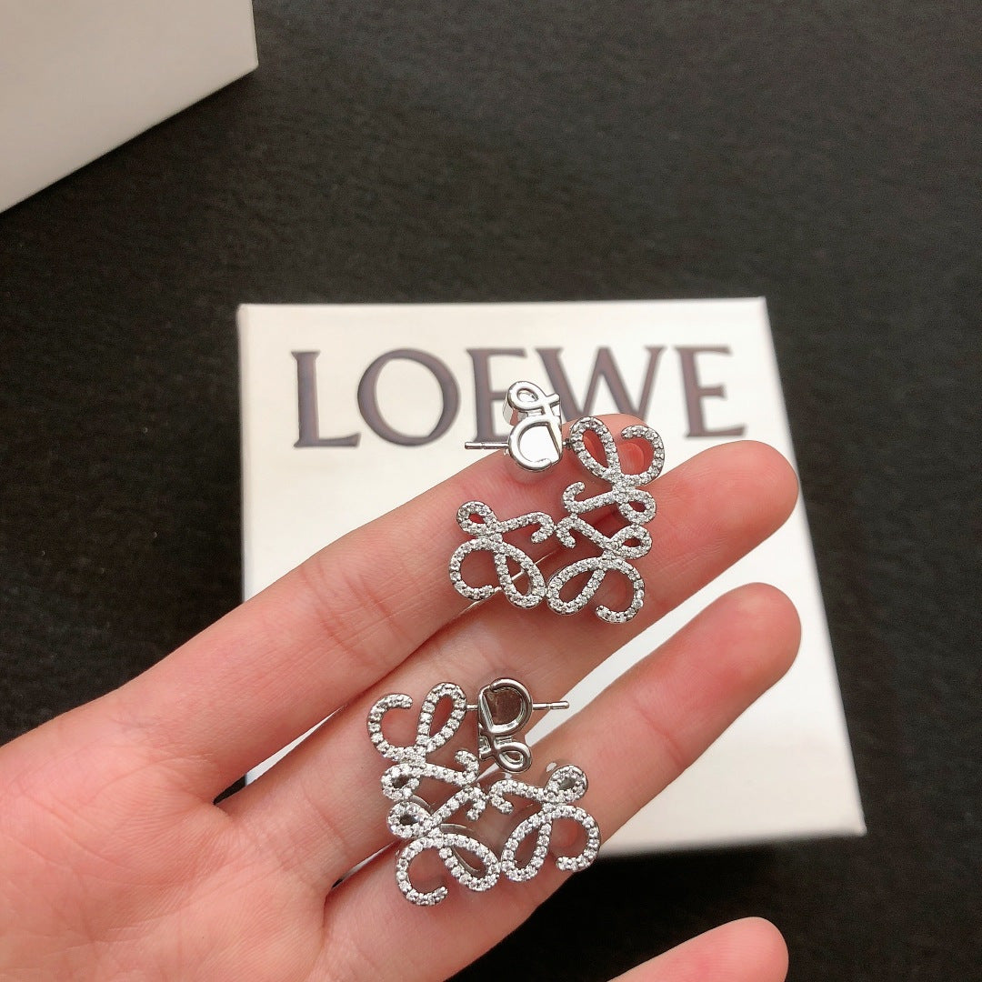 Floral Motif Stud Earrings in Polished Metal-Tone with Crystal-Style Accents main product view