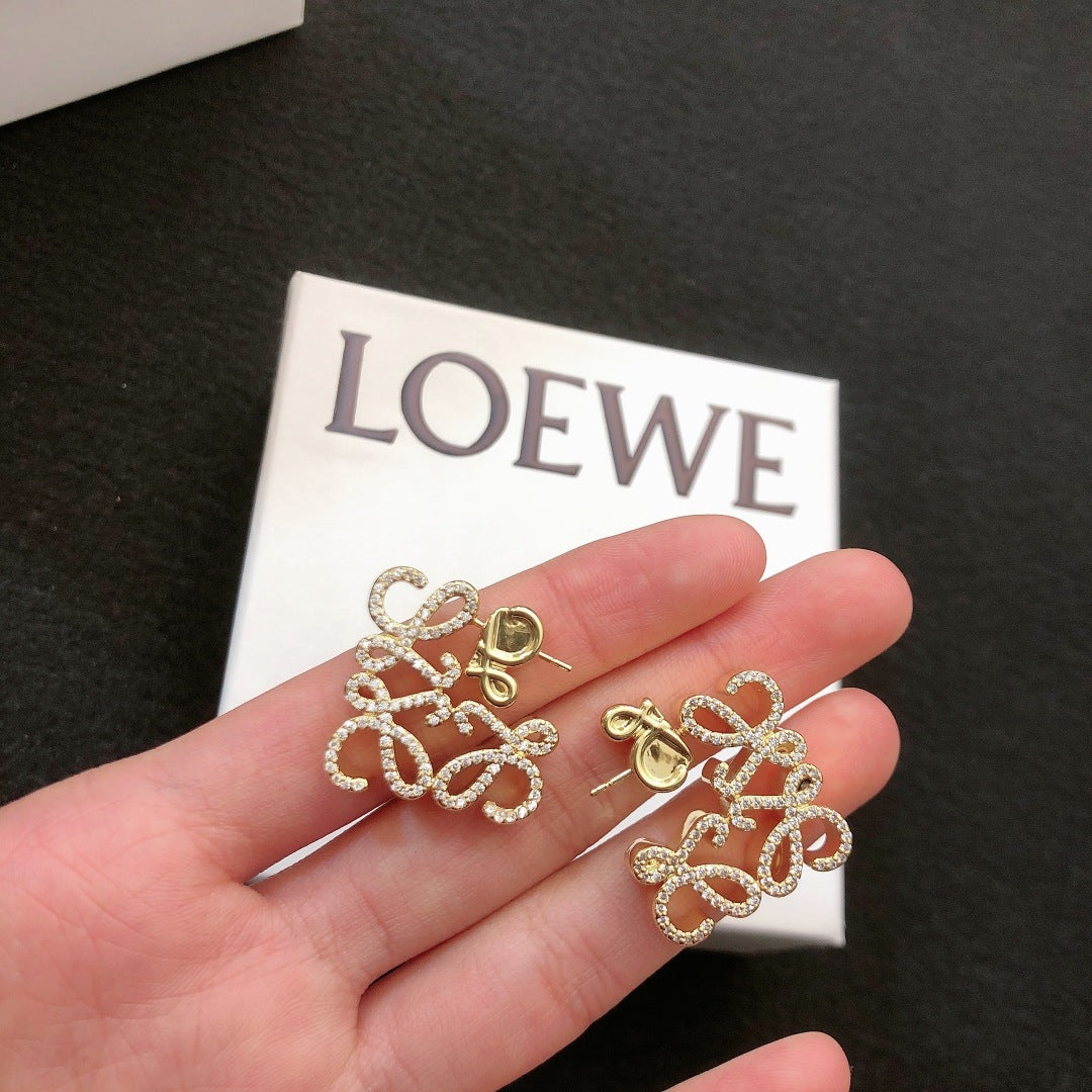 Floral Motif Stud Earrings in Polished Metal-Tone with Crystal-Style Accents close-up detail