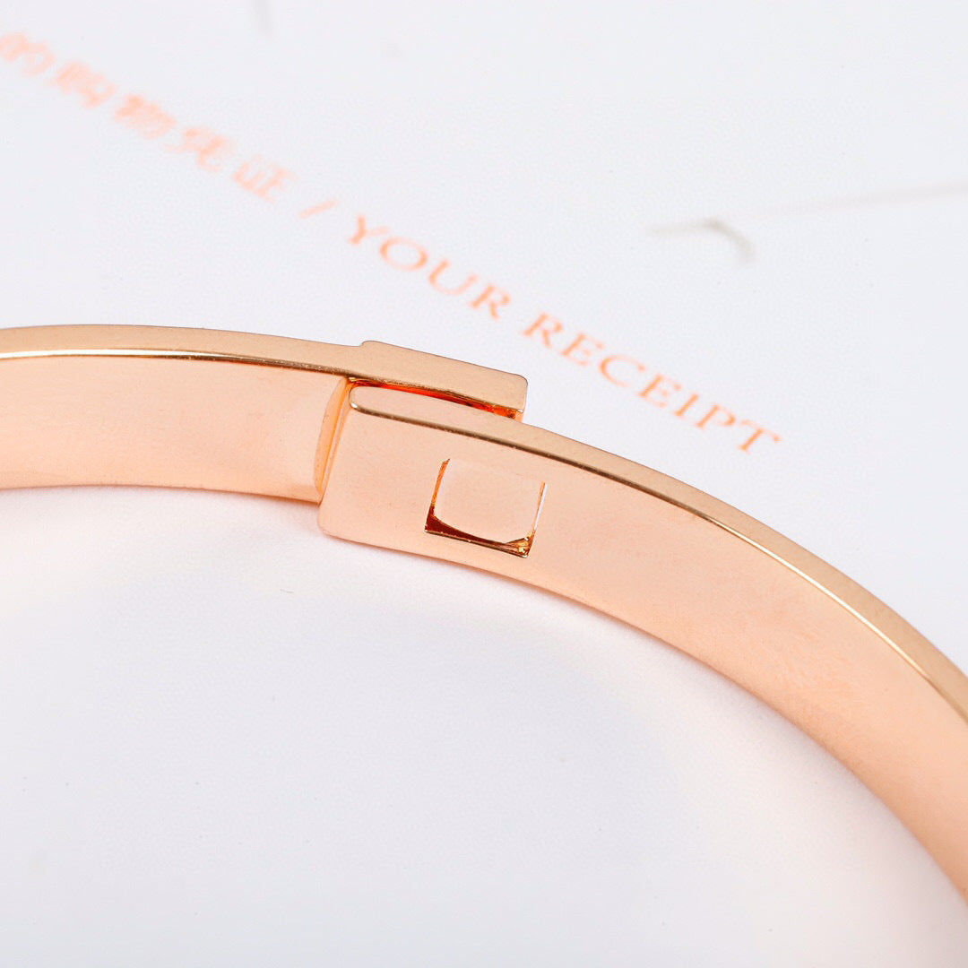Signature Emblem Bangle in Polished Metal-Tone – Design 019 close-up detail