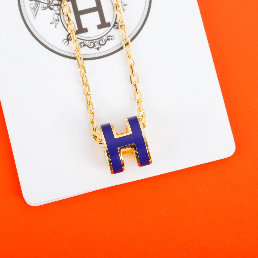 Geometric Emblem Pendant Necklace in Silver-Tone – Gold Detail close-up detail