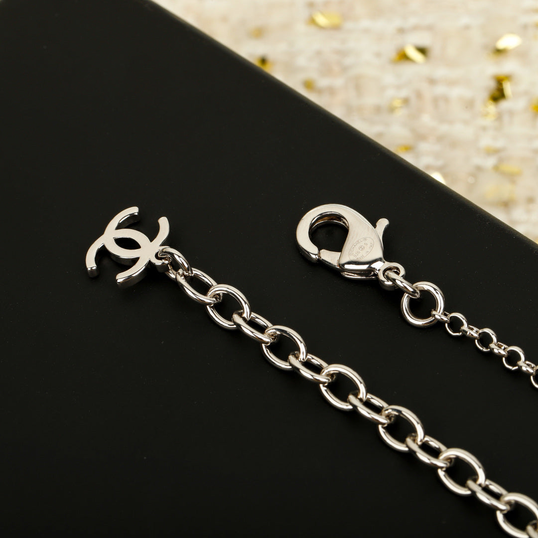 Double-C Emblem Pendant Necklace in Silver-Tone – White Detail – Design 002 close-up detail
