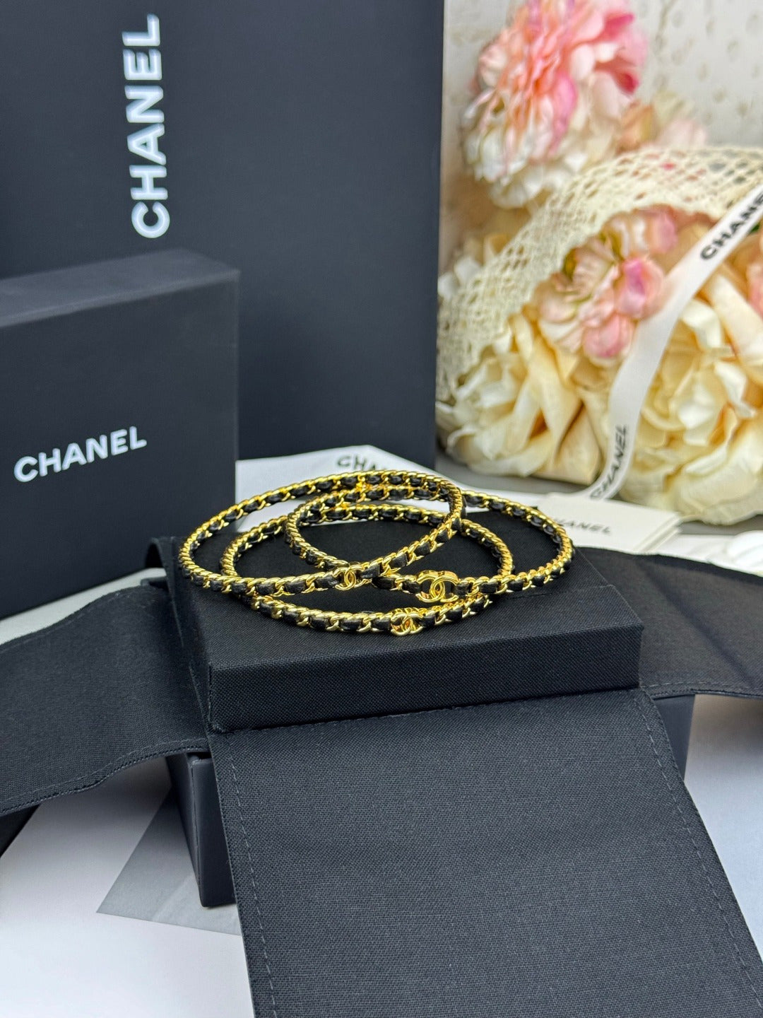 Signature Emblem Bangle in Black-Tone close-up detail