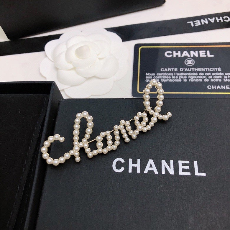 Signature Emblem Brooch in Polished Metal-Tone – Design 036 close-up detail