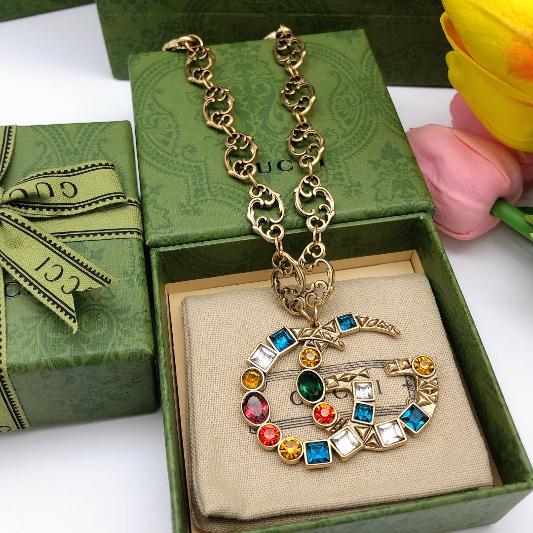 Double-G Emblem Pendant Necklace in Polished Metal-Tone – Crystal Detail main product view