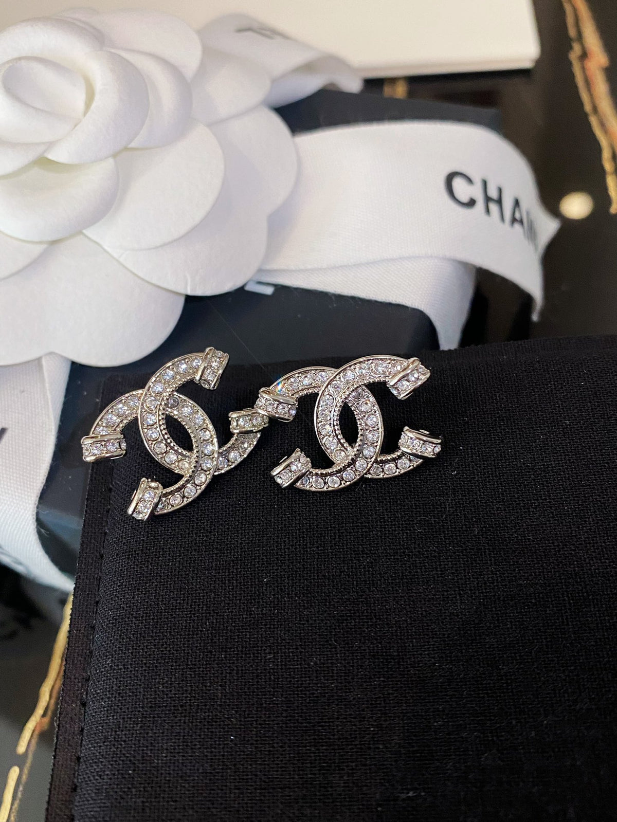 Double-C Emblem Crystal-Accent Stud Earrings – Pink Detail close-up detail