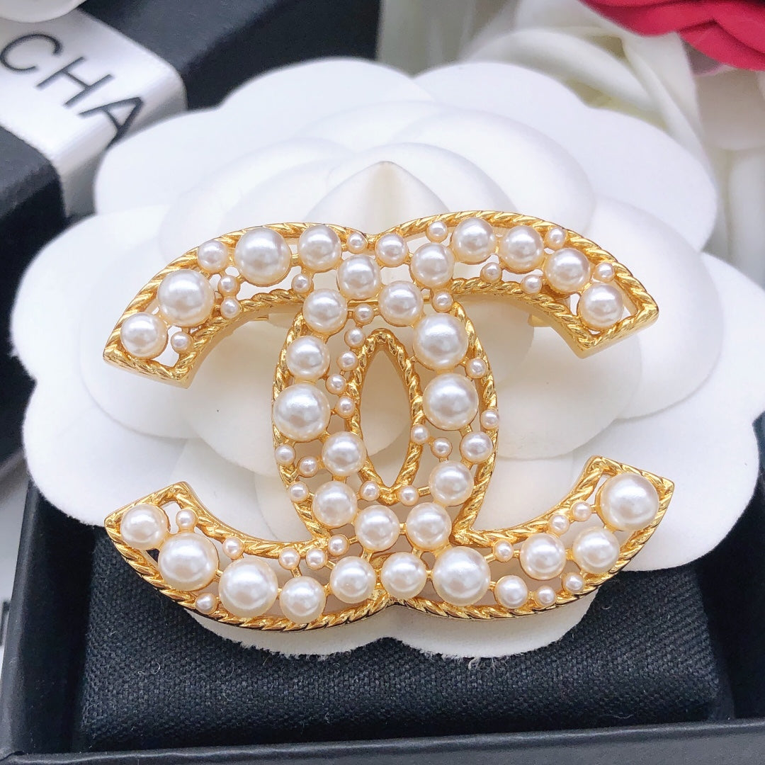 Double-C Emblem Brooch in Gold-Tone – Pearl Detail styled product view