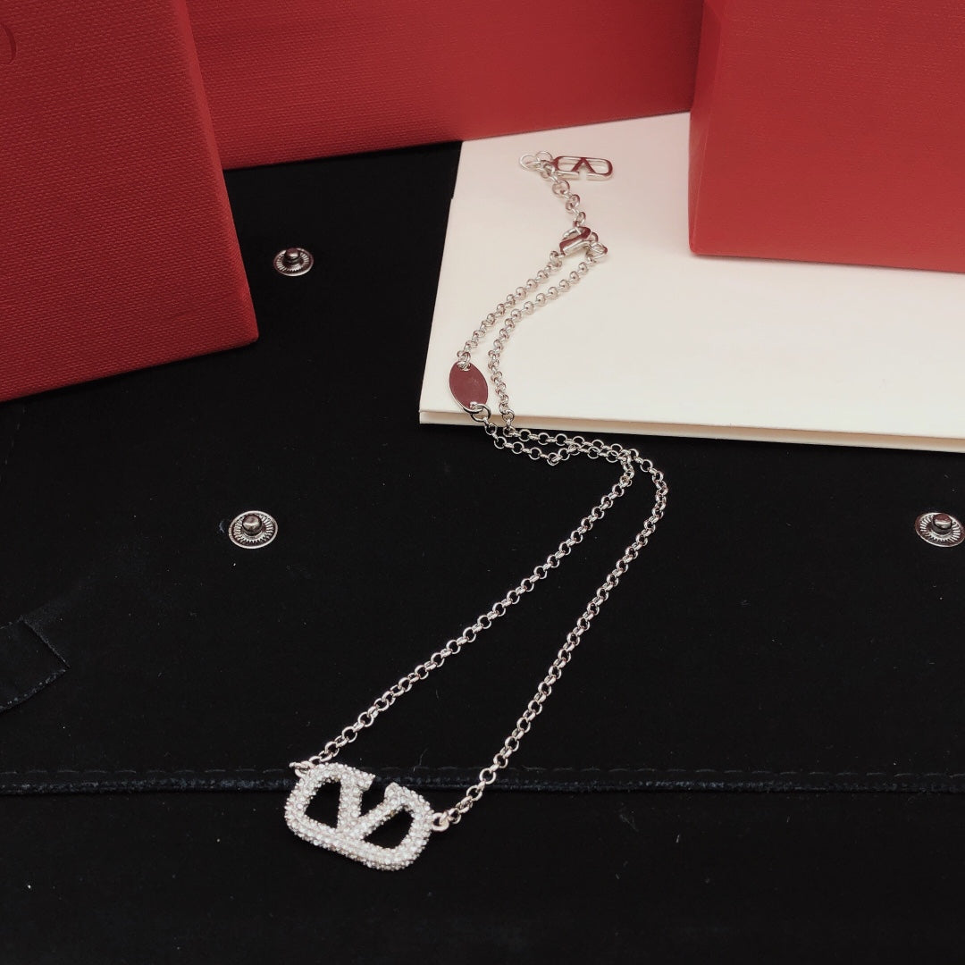Signature Emblem Crystal-Accent Pendant Necklace – Design 04 close-up view