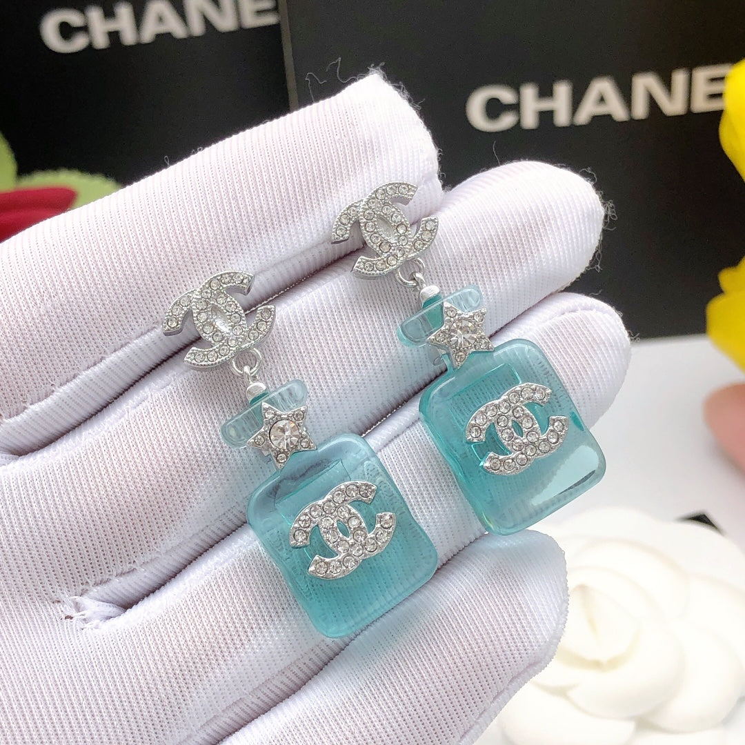 Signature Emblem Stud Earrings in Gold-Tone – Blue Detail – Design 002 detail view