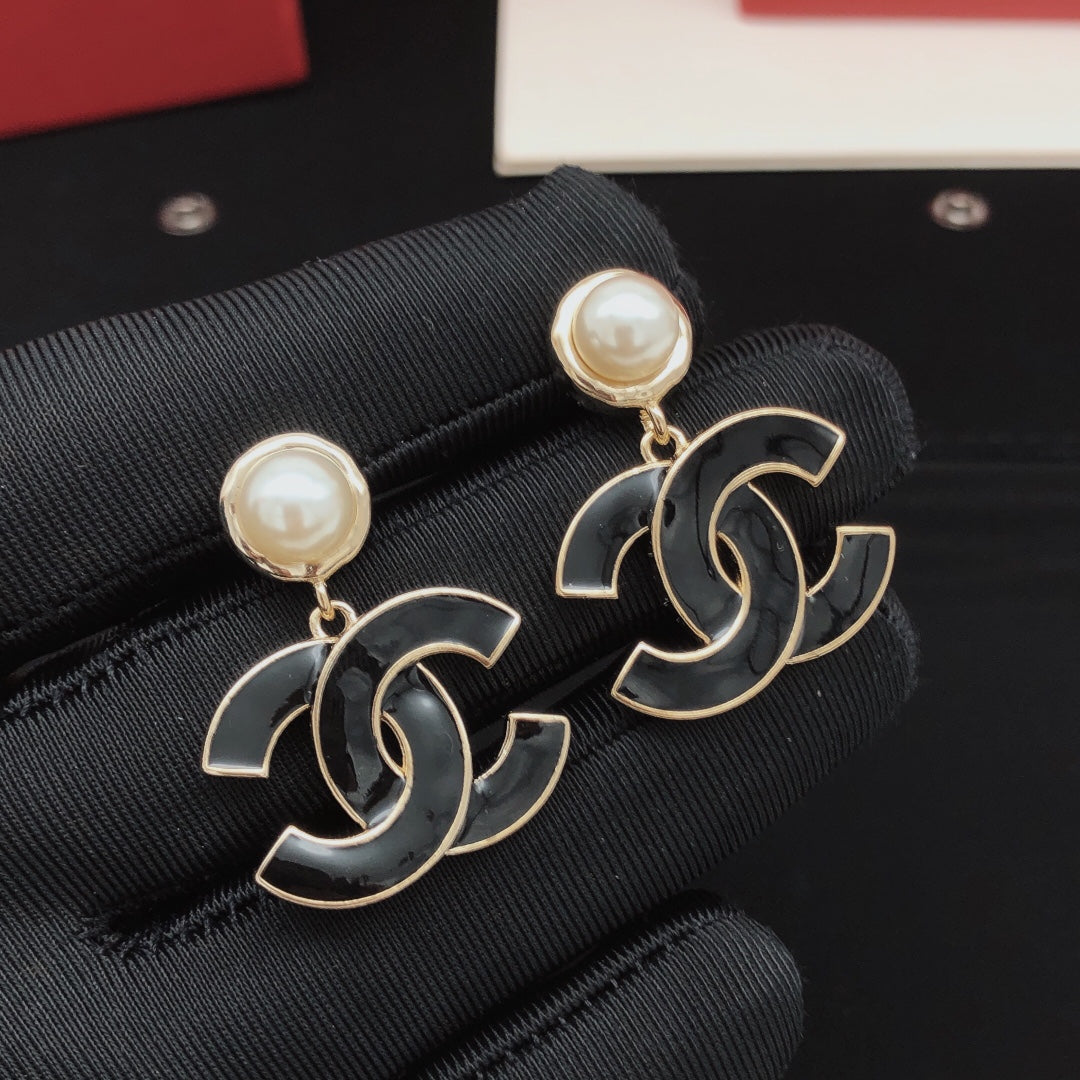 Signature Emblem Stud Earrings in Gold-Tone – Black Detail detail view
