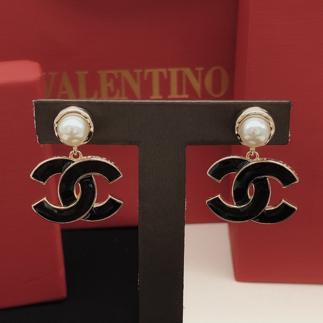 Signature Emblem Stud Earrings in Gold-Tone – Black Detail styled product view
