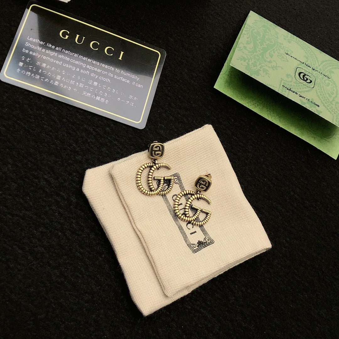 Double-G Emblem Stud Earrings in Polished Metal-Tone – Design 032 styled product view
