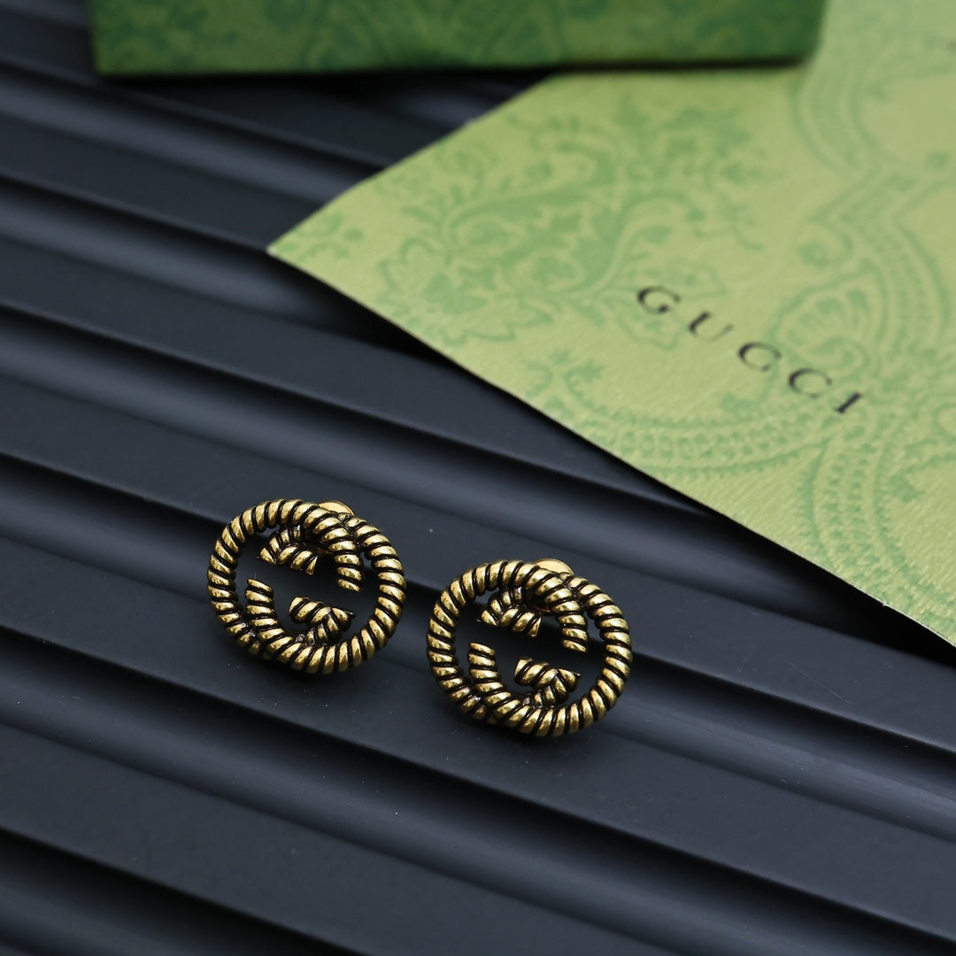 Serpentine Stud Earrings in Polished Metal-Tone front product view