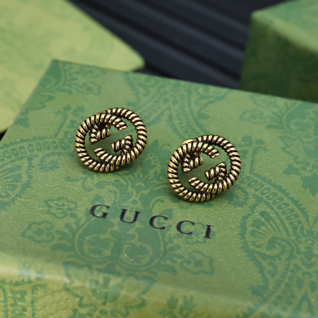 Serpentine Stud Earrings in Polished Metal-Tone detail view