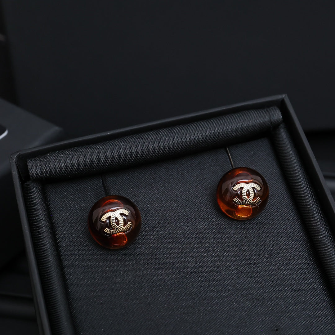 Signature Emblem Stud Earrings in Polished Metal-Tone – Blue Detail front product view