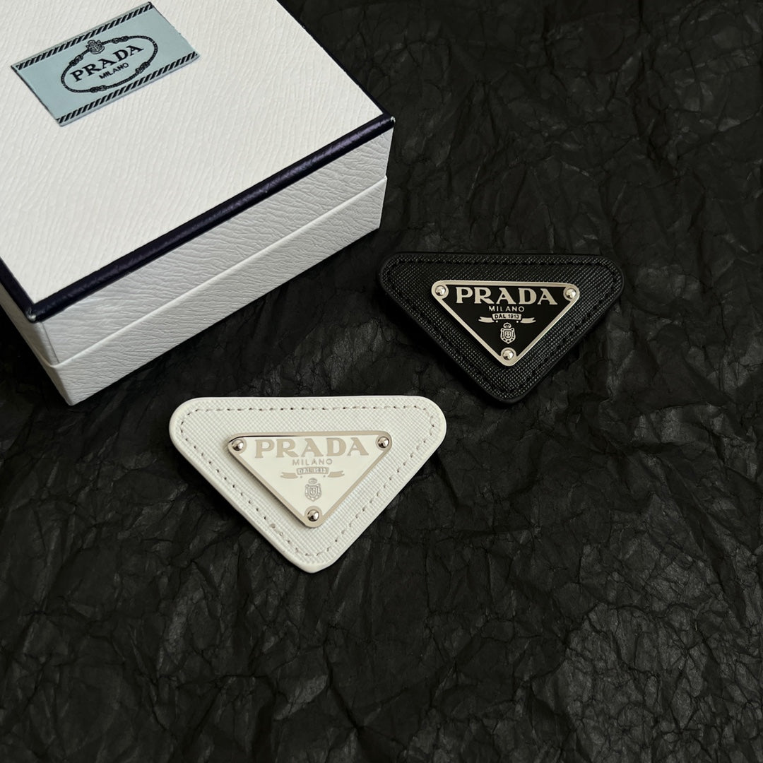 Signature Emblem Brooch in Polished Metal-Tone styled detail