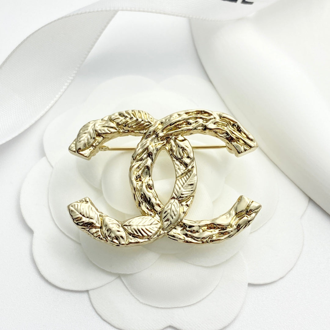 Double-C Emblem Brooch in Polished Metal-Tone – Design 064 detail view