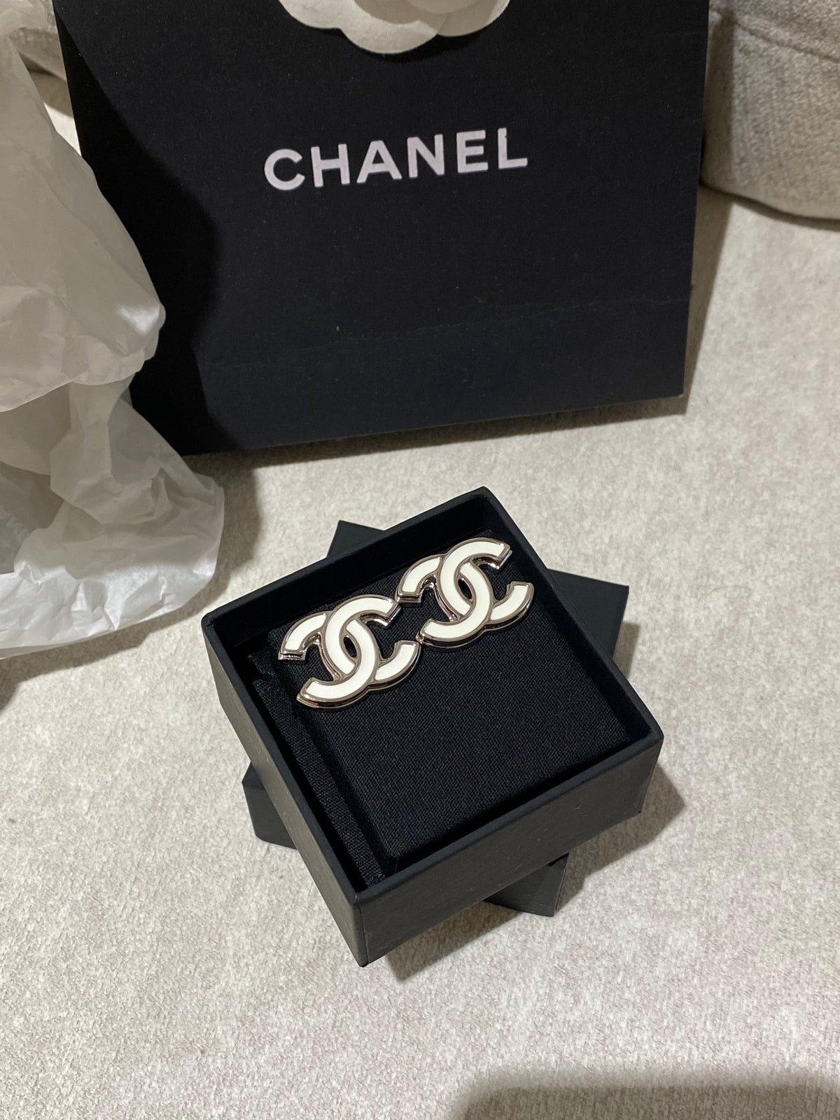 Double-C Emblem Stud Earrings in Polished Metal-Tone – White Detail – Design 004 detail view