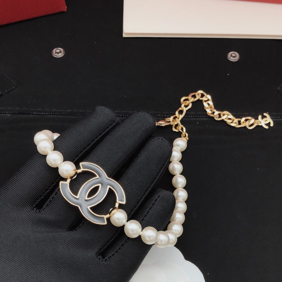 Double-C Emblem Pearl-Detail Pendant Necklace – Pearl Detail – Design 124 detail view