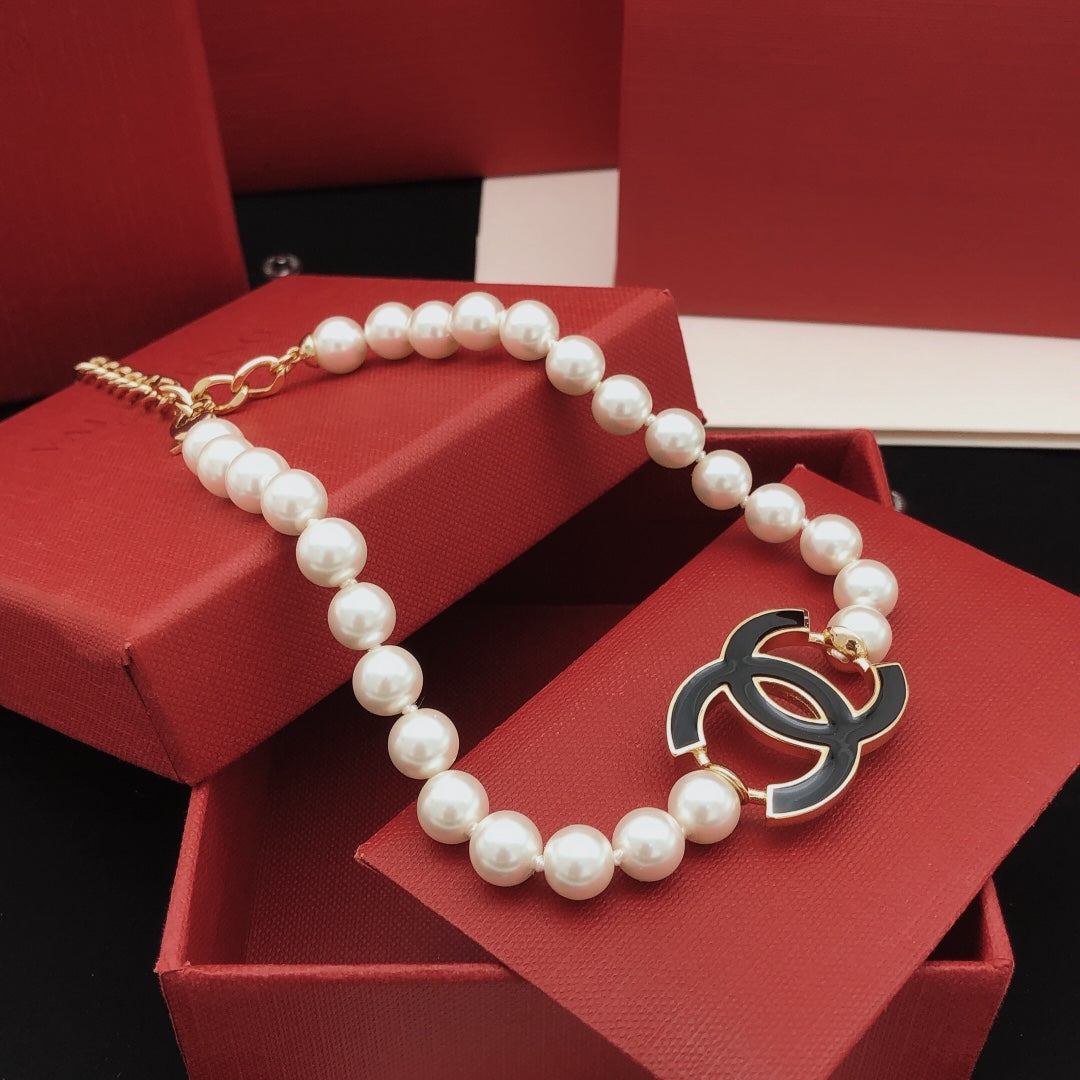 Double-C Emblem Pearl-Detail Pendant Necklace – Pearl Detail – Design 124 side detail